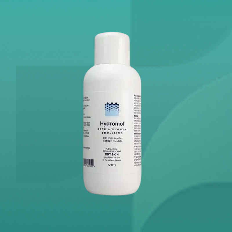 Hydromol Bath and Shower Emollient bottle in white packaging for dry and sensitive skin containing light liquid paraffin suitable for use in bath or shower available at Star Pharmacy UK.