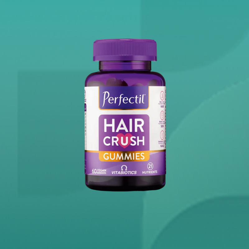 Bottle of Perfectil Hair Crush Gummies by Vitabiotics in purple packaging containing vegan beauty supplements for hair skin and nails nourishment available from Star Pharmacy UK.
